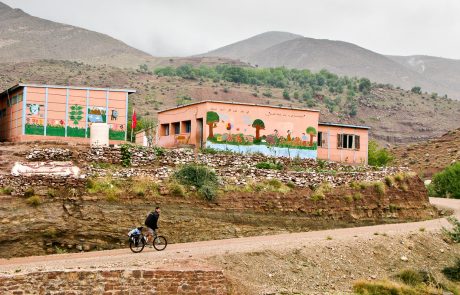 A cyclist passing along a bereber school