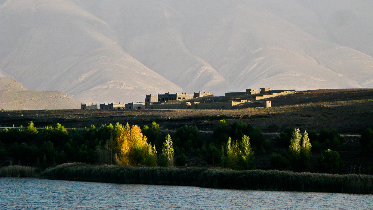 Atlas mountains village with a lake in front