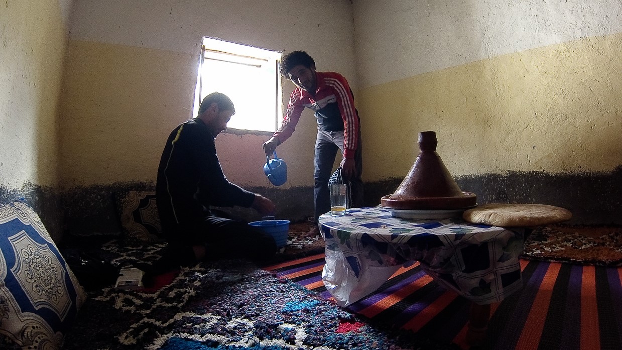 Eid al-Adha. A men washing his hands before eating the day of Eid al-Adha